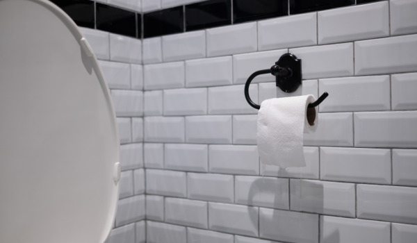 At what height should a toilet paper holder be placed?