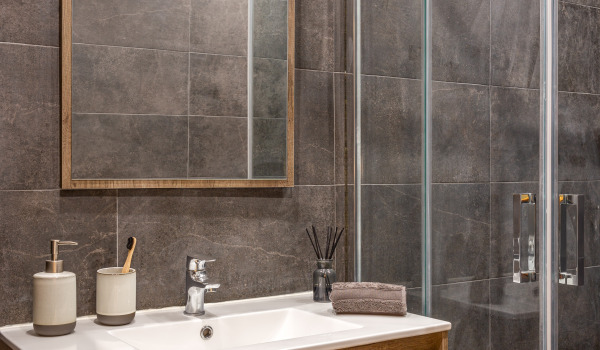 At what height should you hang shower baskets?