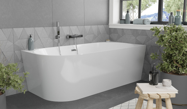 Freestanding Corner Bathtub in a Gray Nature-Inspired Bathroom