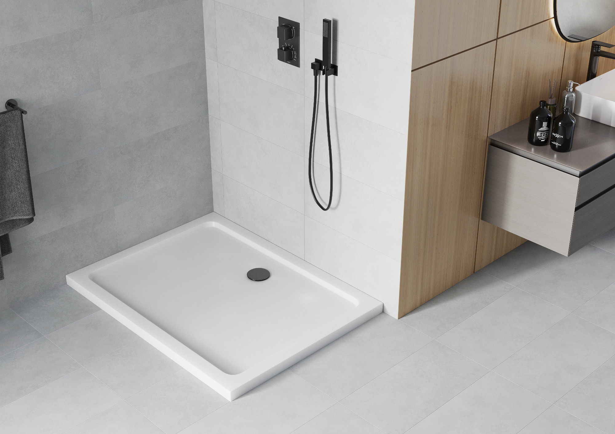 White shower tray with black accessories