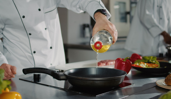 Where to pour oil from the pan - is it okay to put it down the sink?