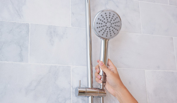 At what height should you hang a shower head?